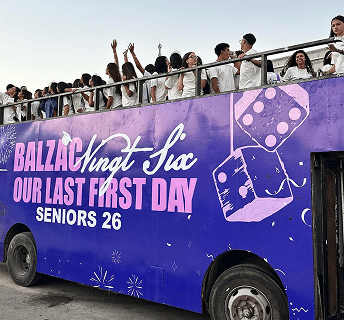 Students on a purple Balzac seniors bus